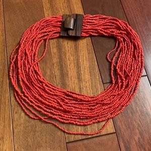 Coral color multiple beaded string necklace